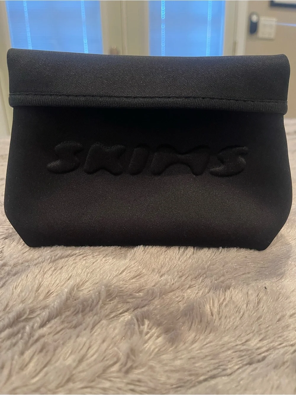 SKIMS Black Neoprene Cosmetic Pouch - Embossed Logo